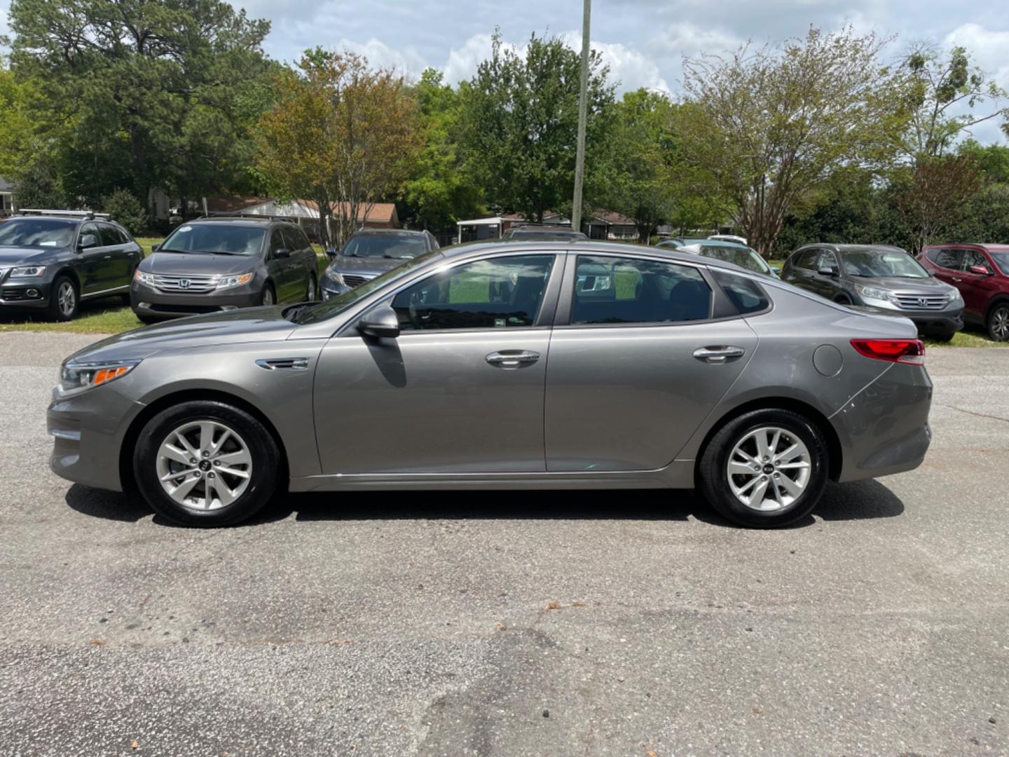 2018 GRAY KIA OPTIMA LX (5XXGT4L34JG) with an 2.4L engine, Automatic transmission, located at 5103 Dorchester Rd., Charleston, SC, 29418-5607, (843) 767-1122, 36.245171, -115.228050 - Roomy Interior with AUX/USB/Sat/Bluetooth, Power Windows, Power Locks, Power Mirrors, Backup Camera, Keyless Entry, Alloy Wheels. 118k miles Located at New Life Auto Sales! 2023 WINNER for Post & Courier's Charleston's Choice Pre-owned Car Dealer AND 2018-2024 Top 5 Finalist for Charleston City Pap - Photo#3